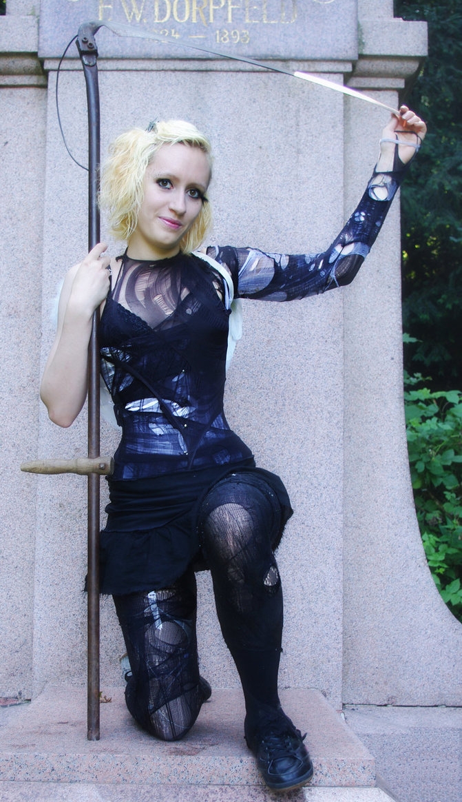 Blonde Gothic Girl wearing Black Opaque Ripped Pantyhose and Black Miniskirt